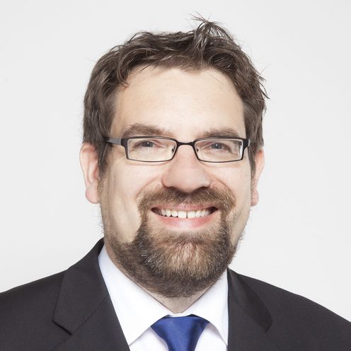 Portrait eines Mannes mit Bart und Brille