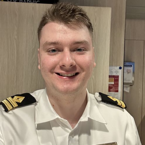 A smiling Dmytro Dudev shown in his uniform on board
