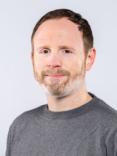 Auf dem Bild ist Andre Franke zusehen. Er hat kurzes braunes Haar und einen grau-r&ouml;tlichen Bart. Er tr&auml;gt einen grauen Pullover.